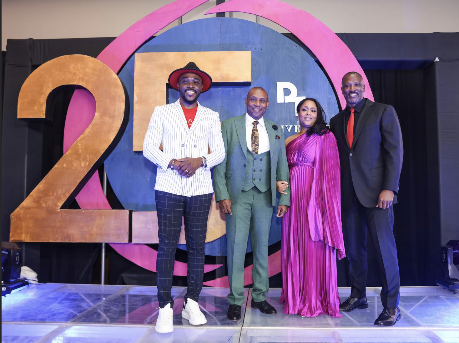 (L-R) Kevin Downswell, Gospel Artiste and event guest performer, poses with Derrimon’s Derrick Cotterell, CEO and Chairman, Monique Cotterell, Group Human Resources Director and Company Secretary and Ian Kelly, Group Chief Financial Officer.